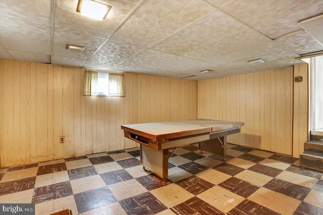 rec room featuring a sauna, wood walls, and tile patterned floors