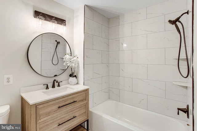 bathroom with shower / bathtub combination, toilet, and vanity