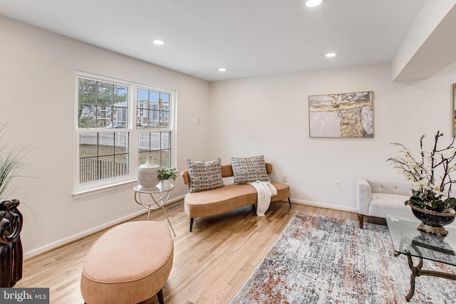 sitting room with recessed lighting, wood finished floors, and baseboards