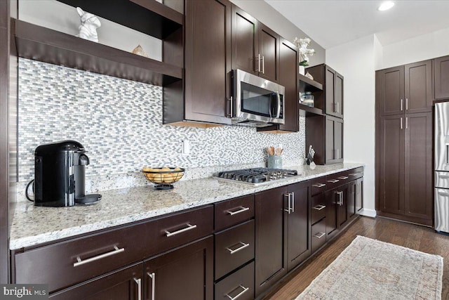 kitchen featuring open shelves, backsplash, dark wood-style floors, stainless steel appliances, and dark brown cabinetry