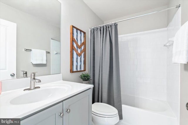 bathroom featuring shower / bath combination with curtain, toilet, and vanity