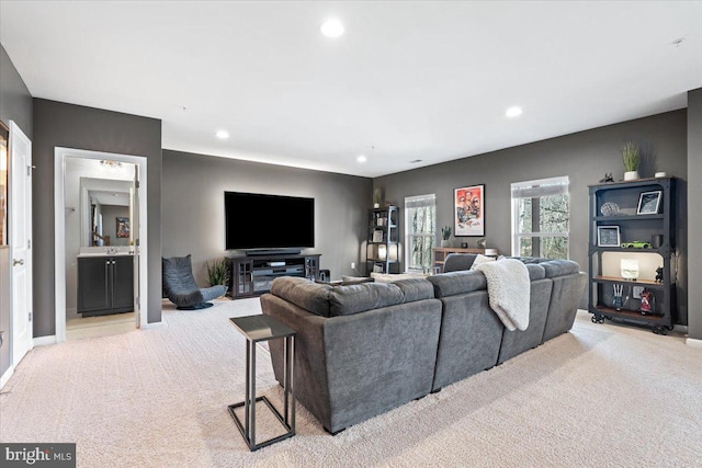 living area with recessed lighting, baseboards, and carpet flooring