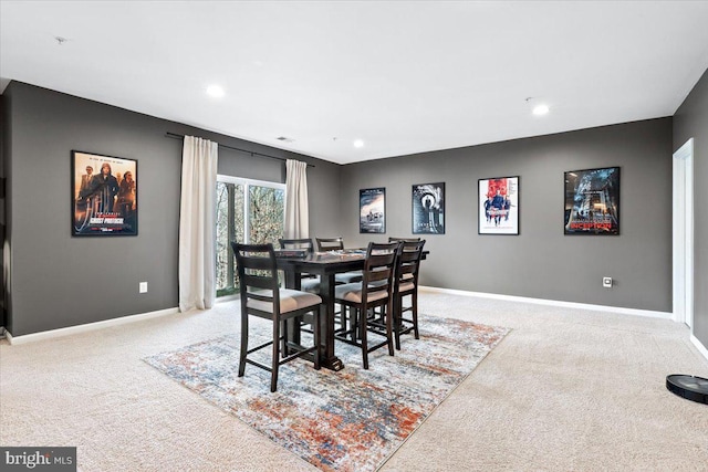 carpeted dining space featuring recessed lighting and baseboards