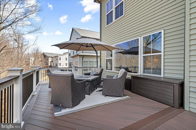 wooden deck with an outdoor living space