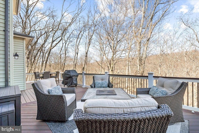 deck featuring grilling area and outdoor lounge area