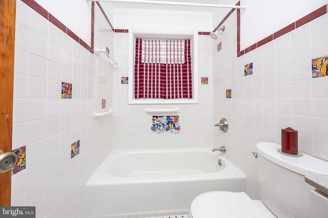 full bath featuring tile walls, toilet, and shower / bathtub combination