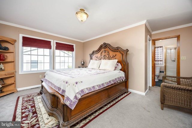 bedroom with crown molding, carpet flooring, and baseboards