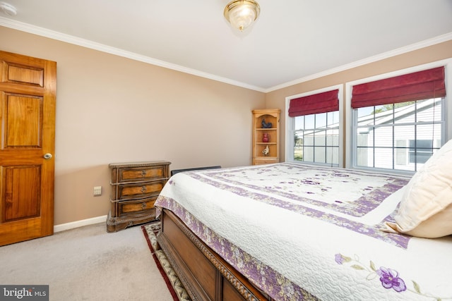 bedroom with light colored carpet, crown molding, and baseboards