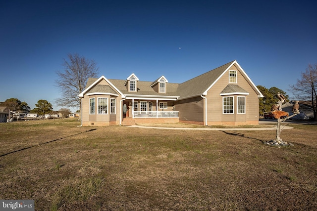 view of front facade with crawl space, covered porch, and a front lawn