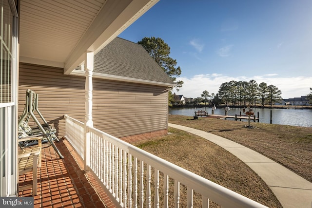 balcony featuring a water view