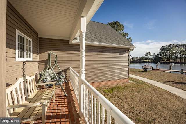 balcony featuring a water view