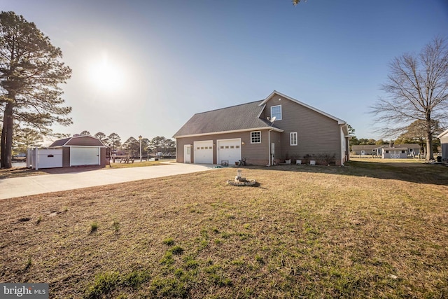 view of property exterior with driveway, an attached garage, and a yard