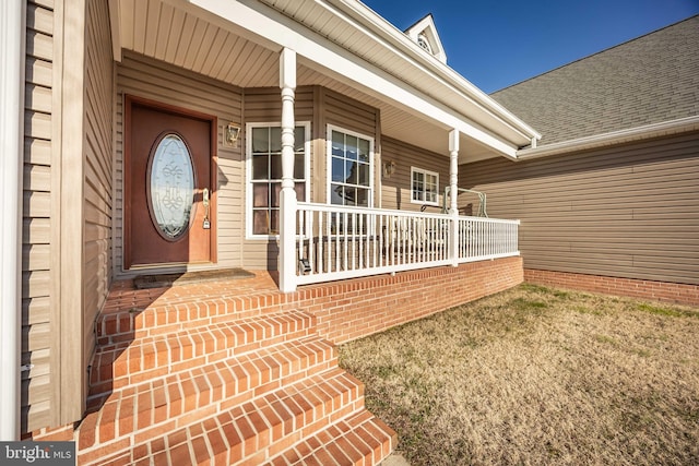 property entrance with covered porch