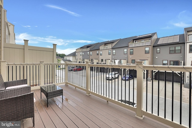 wooden deck featuring a residential view