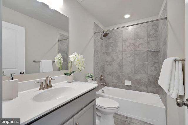 bathroom with shower / washtub combination, tile patterned flooring, vanity, and toilet