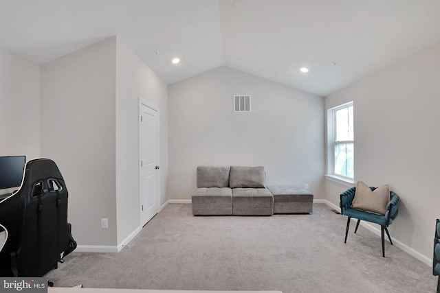 sitting room featuring lofted ceiling, baseboards, visible vents, and carpet flooring