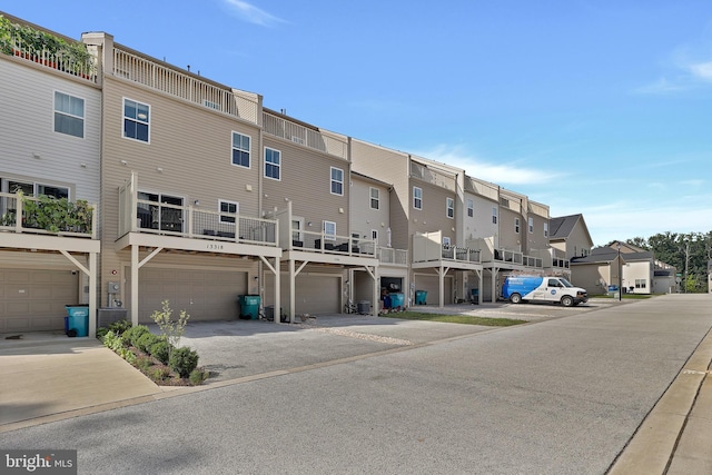 exterior space with an attached garage and a residential view