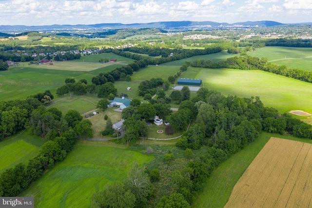 birds eye view of property with a mountain view and a rural view