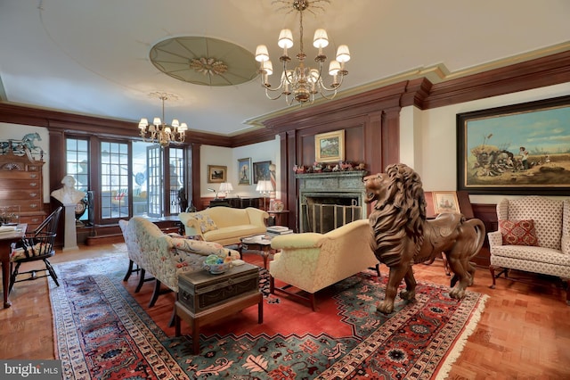 living room featuring a fireplace, crown molding, and an inviting chandelier