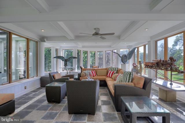 sunroom with beam ceiling and ceiling fan