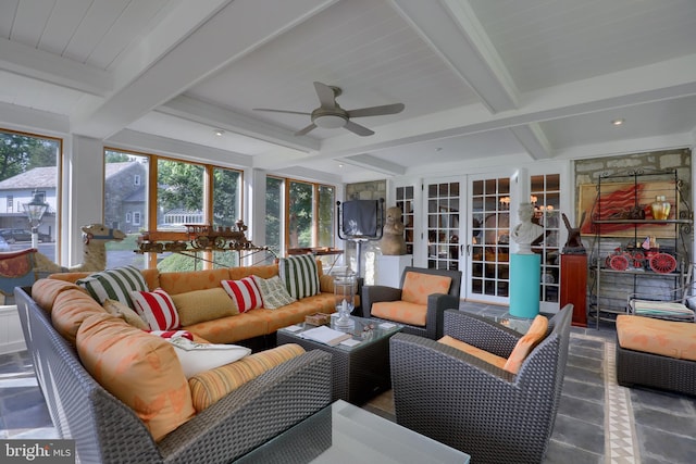 sunroom / solarium with a ceiling fan, beamed ceiling, and french doors