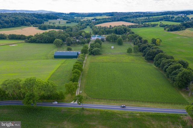 birds eye view of property featuring a rural view