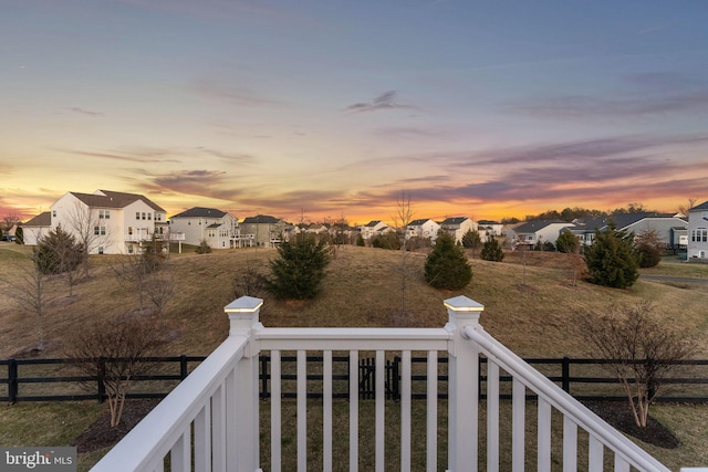 balcony at dusk with a residential view