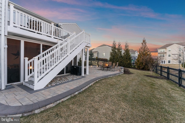 view of yard featuring a fenced backyard, a patio, and stairs