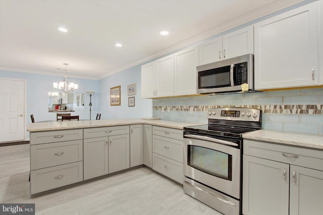 kitchen featuring tasteful backsplash, ornamental molding, light stone counters, a peninsula, and stainless steel appliances