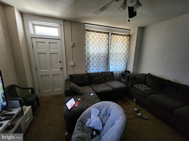 living room featuring ceiling fan and carpet floors