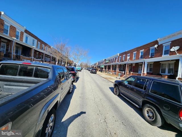 view of road with sidewalks and a residential view