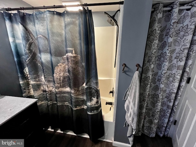 full bathroom featuring shower / tub combo, wood finished floors, and vanity