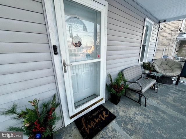 doorway to property with a porch