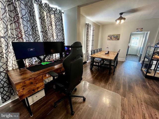 home office featuring hardwood / wood-style flooring and baseboards