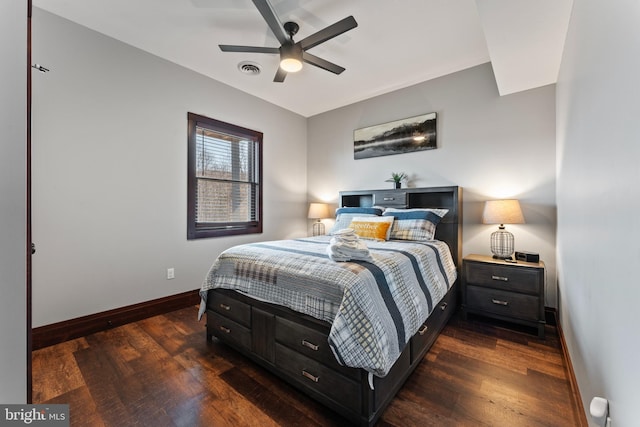 bedroom featuring visible vents, wood finished floors, baseboards, and ceiling fan