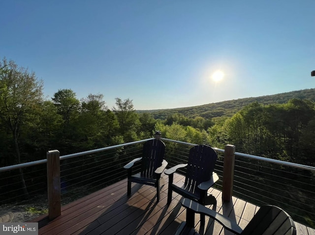 wooden terrace with a forest view