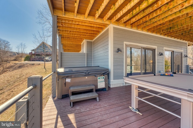 deck with a hot tub