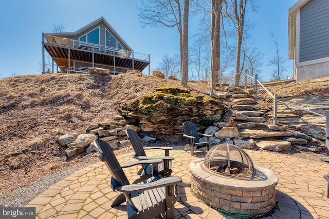 view of patio with an outdoor fire pit