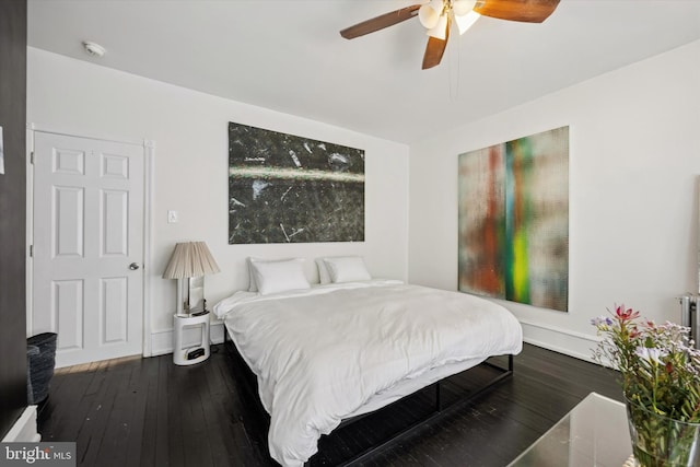 bedroom featuring a ceiling fan and hardwood / wood-style floors