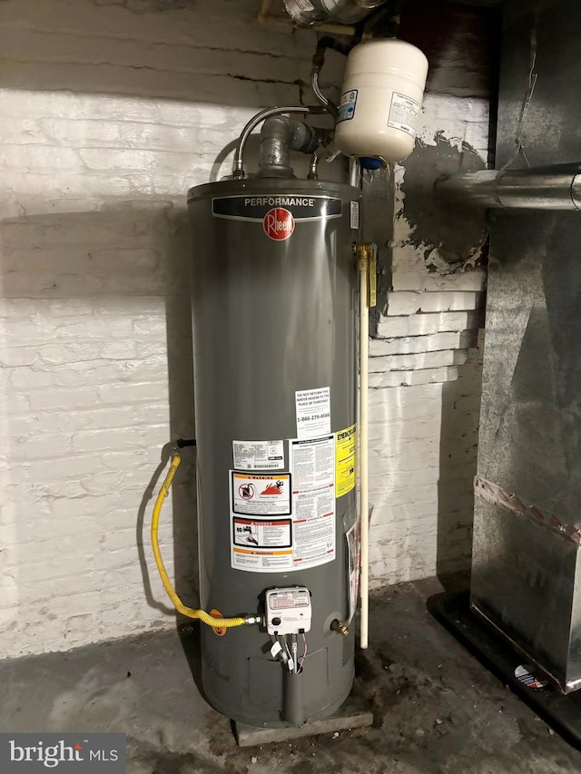 utility room featuring gas water heater