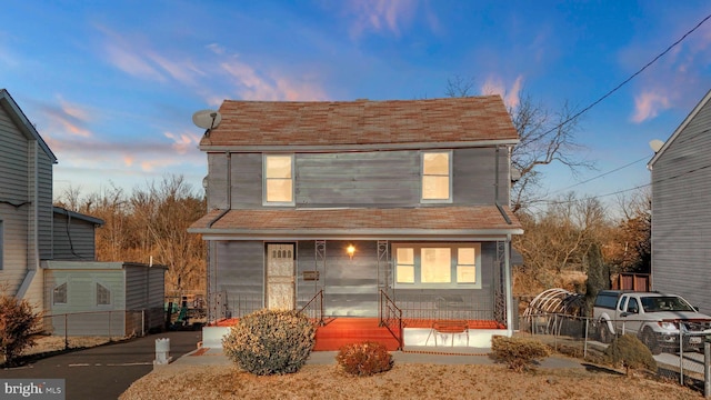 view of front of home with fence