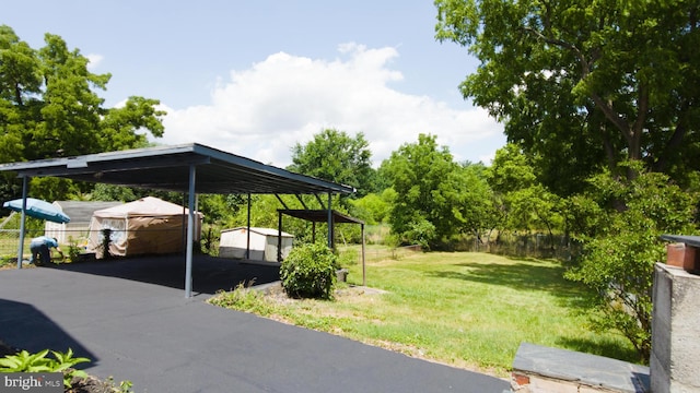 view of parking featuring fence