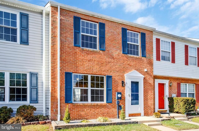 view of property with brick siding