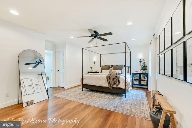 bedroom featuring baseboards, light wood finished floors, and recessed lighting