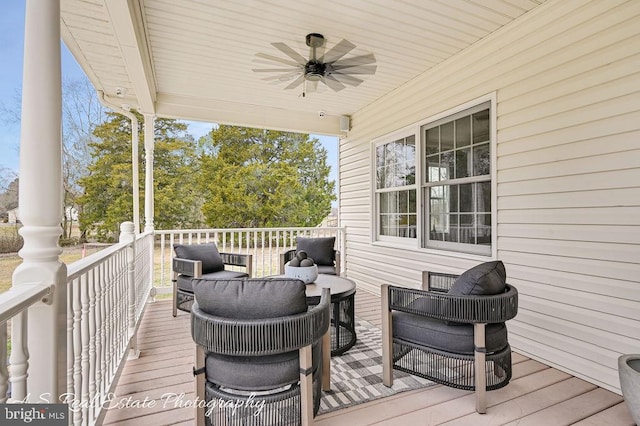 wooden terrace featuring ceiling fan