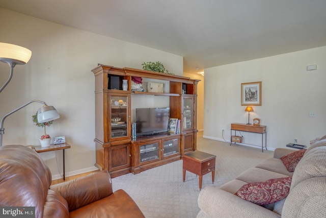 living room with carpet flooring and baseboards