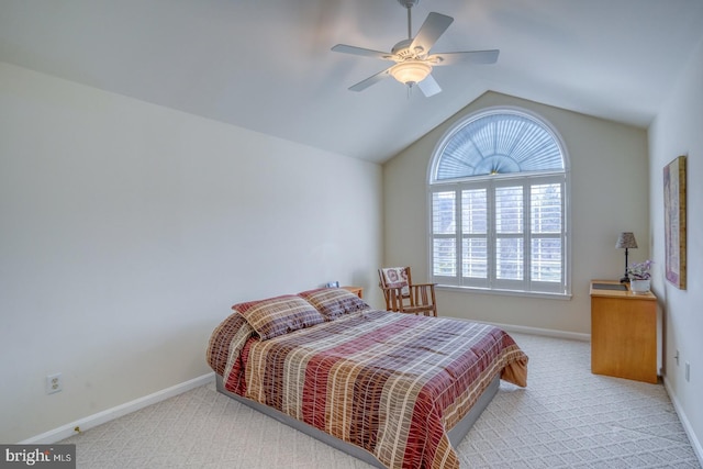 bedroom with lofted ceiling, light carpet, ceiling fan, and baseboards