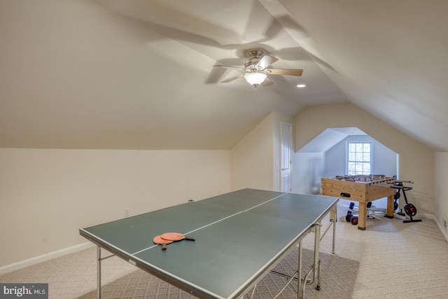 rec room with vaulted ceiling, ceiling fan, carpet, and baseboards