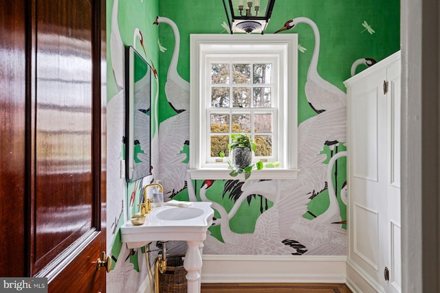 bathroom featuring wallpapered walls