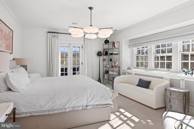 carpeted bedroom featuring access to outside and crown molding